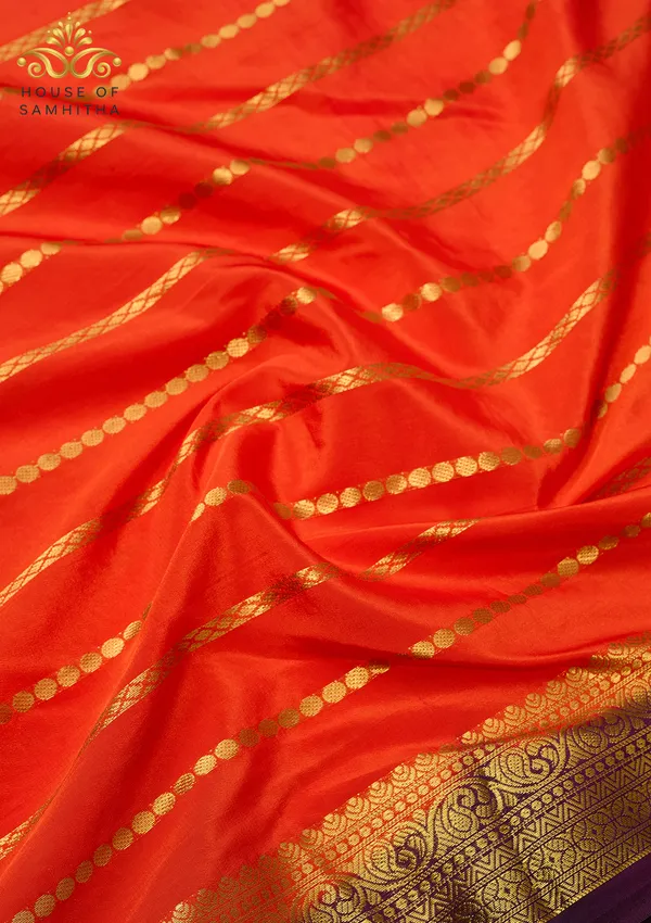 Radiant_Orange_Semi-Crepe_Silk_Saree_With_Horizontal_Zari_Stripes_And_Rich_Purple_Border