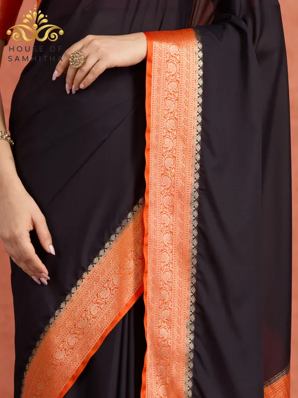 Elegant_Black_Saree_With_Contrast_Orange_Border