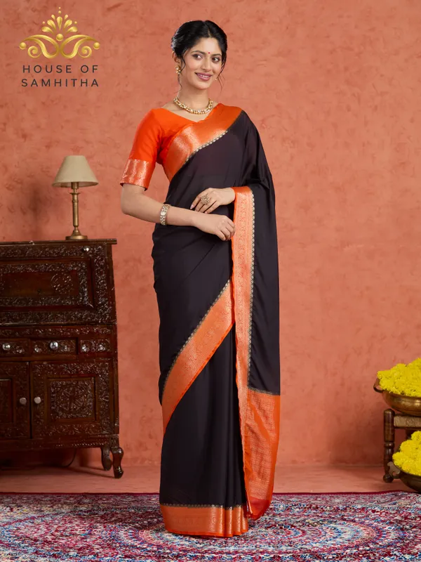 Elegant_Black_Saree_With_Contrast_Orange_Border