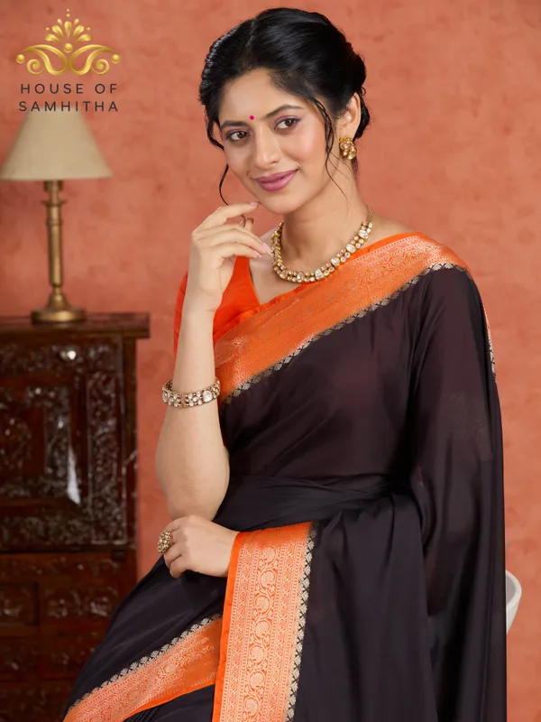 Elegant_Black_Saree_With_Contrast_Orange_Border