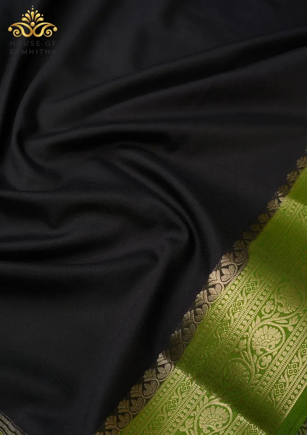 Timeless_Black_Semi-Crape_Silk_Saree_Featuring_A_Contrast_Mehendi_Green_Zari_Border
