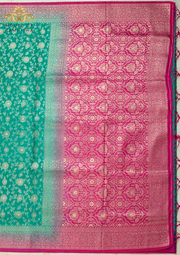 Charming_Sea_Green_Banarasi_Imitation_Semi-Silk_Saree_With_Floral_Zari_Brocade_And_Contrast_Rani_Pink_Border