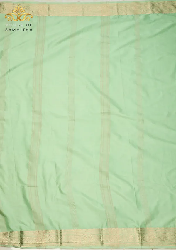 Elegant_Pista_Green_Semi-Crape_Saree_With_Traditional_Gold_Zari_Border