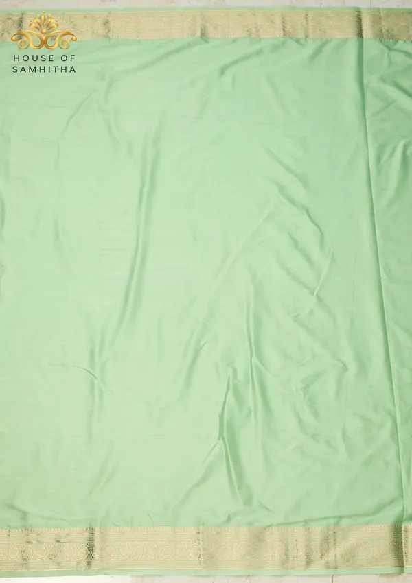 Elegant_Pista_Green_Semi-Crape_Saree_With_Traditional_Gold_Zari_Border