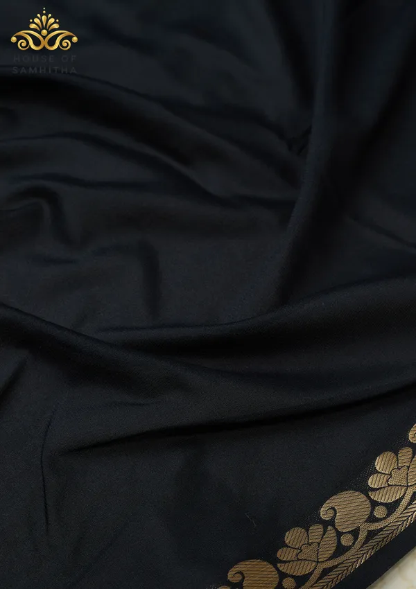 Elegant_Black_Semi-Crape_Saree_With_Lotus_And_Paisley_Gold_Zari_Border