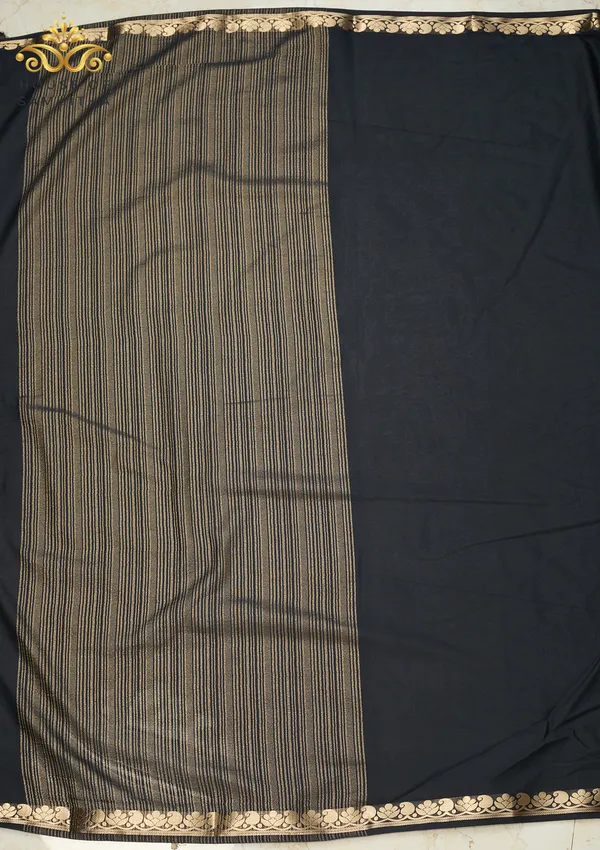 Elegant_Black_Semi-Crape_Saree_With_Lotus_And_Paisley_Gold_Zari_Border