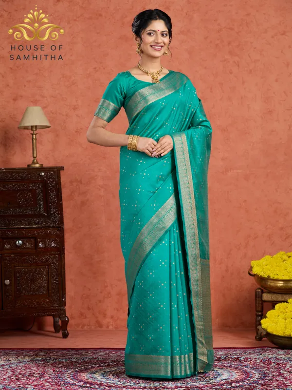 Regal_Rama_Green_Semi-Kanchi_Pattu_Saree_With_Gold_Zari_Butas_And_Traditional_Brocade_Border
