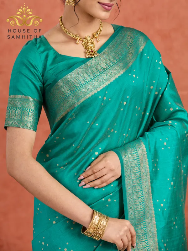 Regal_Rama_Green_Semi-Kanchi_Pattu_Saree_With_Gold_Zari_Butas_And_Traditional_Brocade_Border