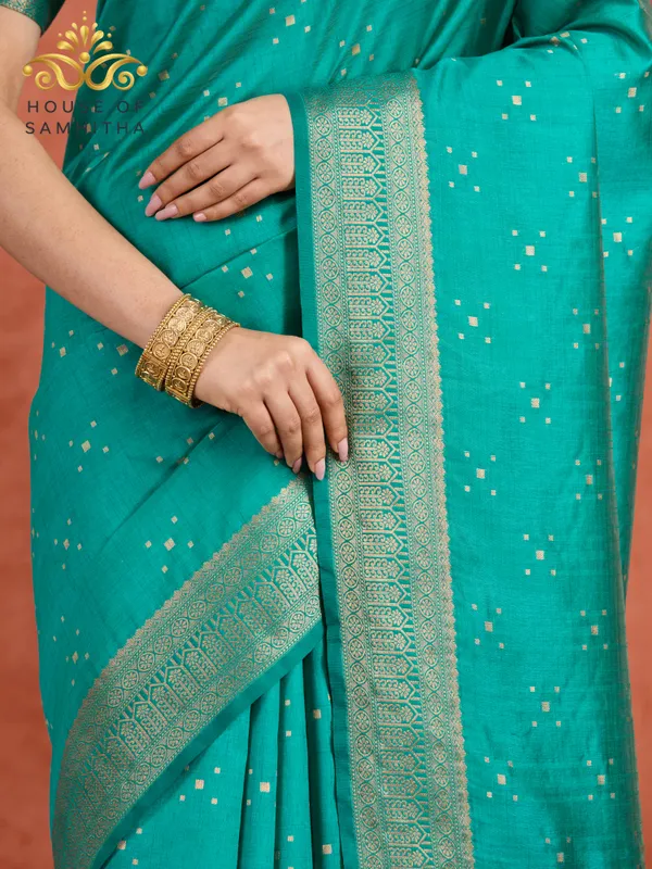 Regal_Rama_Green_Semi-Kanchi_Pattu_Saree_With_Gold_Zari_Butas_And_Traditional_Brocade_Border