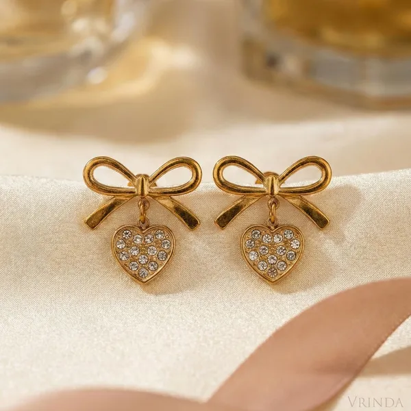 Gold_Plated_22_K_Bow_Studs_With_Crystal_Heart_Drop