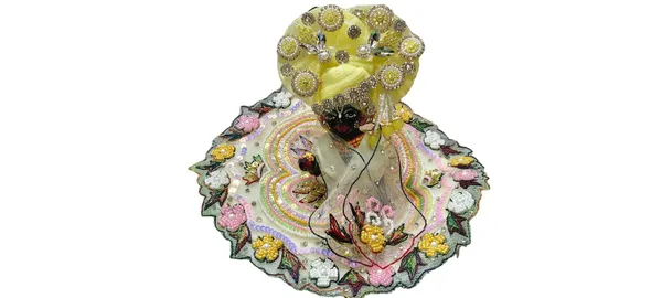 LADU_GOPAL_HANDMADE_POSHAK_3_PC_SETWhy_Choose_This_Poshak?_This_is_a_"Masterpiece"_set_for_devotees_who_want_an_exclusive,_high-end_look_for_their_Thakur_Ji._The_combination_of_vibrant_multi-color_embroidery_against_the_soft_ivory_fabric_offers_a_celestial_and_joyful_aesthetic_that_will_make_your_deity_the_centerpiece_of_devotion._Care_Instructions:_Dry_clean_only._Handle_with_extreme_care_to_maintain_the_integrity_of_the_delicate_pearl_settings_and_heavy_sequin_work.