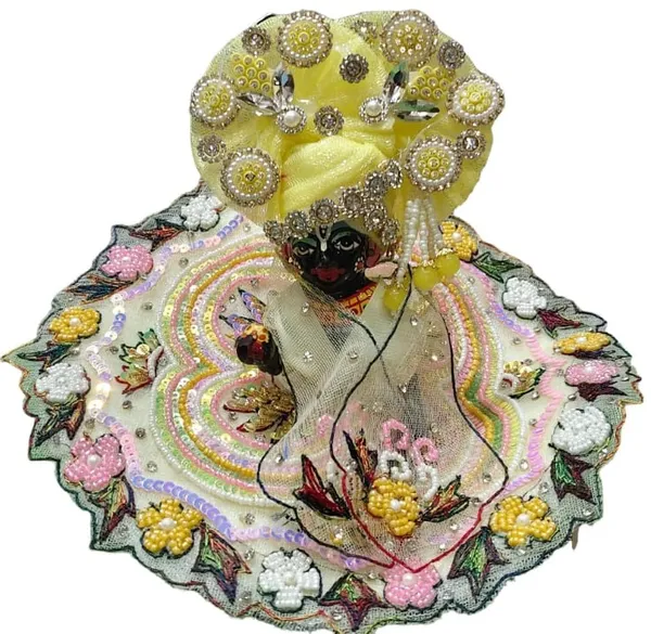 LADU_GOPAL_HANDMADE_POSHAK_3_PC_SETWhy_Choose_This_Poshak?_This_is_a_"Masterpiece"_set_for_devotees_who_want_an_exclusive,_high-end_look_for_their_Thakur_Ji._The_combination_of_vibrant_multi-color_embroidery_against_the_soft_ivory_fabric_offers_a_celestial_and_joyful_aesthetic_that_will_make_your_deity_the_centerpiece_of_devotion._Care_Instructions:_Dry_clean_only._Handle_with_extreme_care_to_maintain_the_integrity_of_the_delicate_pearl_settings_and_heavy_sequin_work.