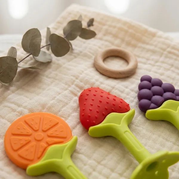 Silicone_Fruit_Teether_For_Baby_|_Fruit_Shape_Soft_Teething_Chew_Toys_For_Newborn_Babies_5_Piece_+_Super_Comfort_Pant_Style_Baby_Diapers,_Cotton_Ultra_Soft_Diaper_With_Leakage_Guard_&_Anti-Bacterial,_Moisture_Lock_Upto_12_Hrs,_Pack_Of_25_Diapers