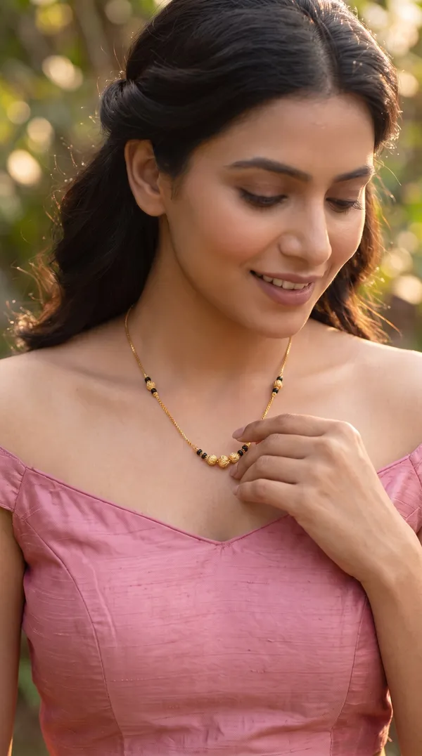 Golden_Noir_Asymmetric_Bead_Chain_Necklace_with_Sculpted_Gold_Accents_for_Women