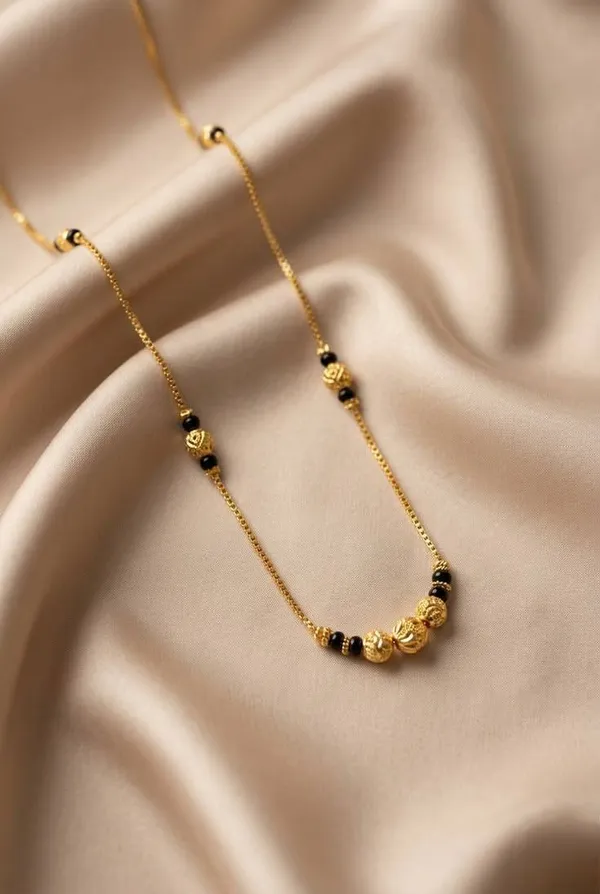 Golden_Noir_Asymmetric_Bead_Chain_Necklace_with_Sculpted_Gold_Accents_for_Women