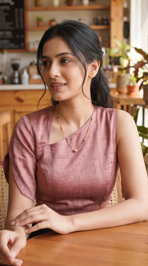 Add_a_graceful_traditional_touch_to_your_jewellery_collection_with_this_elegant_black-beaded_mangalsutra._Featuring_gold-toned_bead_detailing_and_a_beautifully_curved_crystal-studded_pendant,_it_offers_a_sophisticated_blend_of_traditional_charm_and_modern_elegance._Perfect_for_daily_wear,_festive_occasions,_family_functions,_and_special_gatherings._Pairs_beautifully_with_sarees,_kurtis,_ethnic_dresses,_and_other_traditional_outfits.
