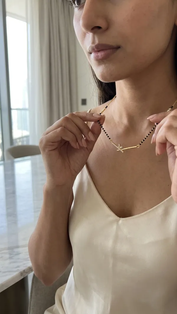 Storie_Taylor_Modern_Gold-Plated_Bar_Mangalsutra_with_Crystal_Leaf_Detail_-_Stylish_Daily_Wear_Black_Bead_Necklace