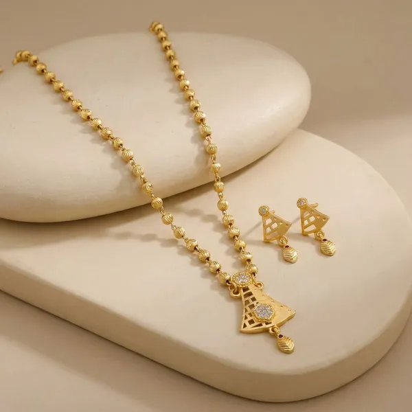 Golden_Beaded_Necklace_Set_With_Triangle_Pendant_And_Matching_Earrings