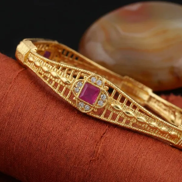 Traditional_Gold_Plated_Bangles_With_Pink_Stone_Embellishments_Set_Of_2