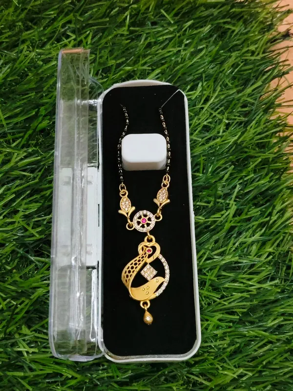 Gold_Toned_Crescent_Moon_Pendant_Necklace_With_Pink_Stones_And_Black_Enamel_Work