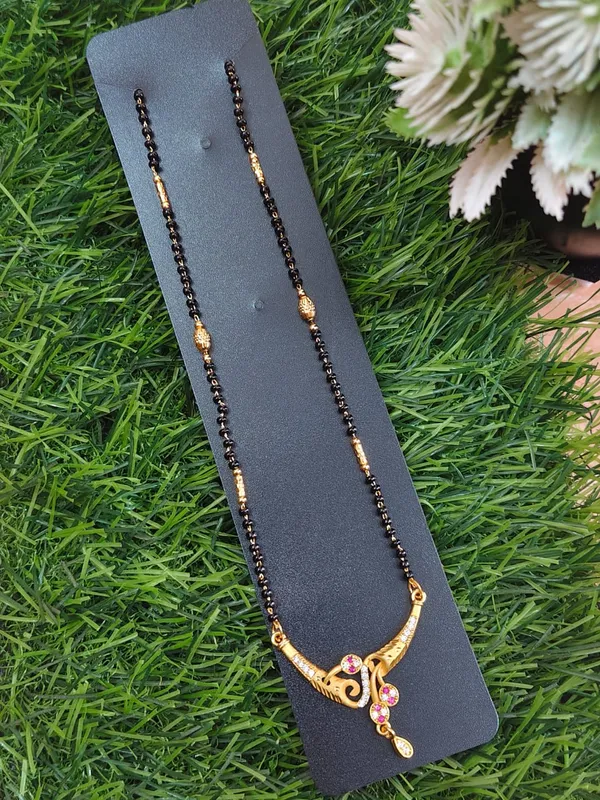 Black_Beaded_Mangalsutra_With_Gold_Tone_Pendant_And_Pink_Stone_Embellishments