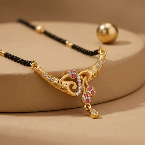 Black_Beaded_Mangalsutra_With_Gold_Tone_Pendant_And_Pink_Stone_Embellishments