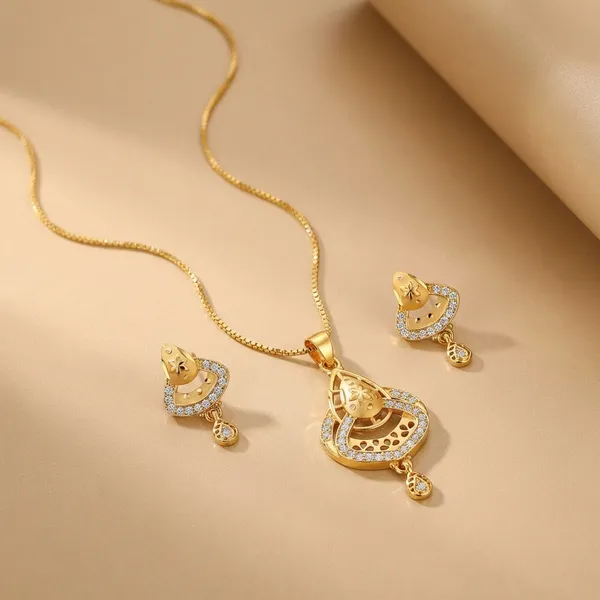 Gold_Toned_Necklace_And_Earrings_Set_With_Intricate_Detailing