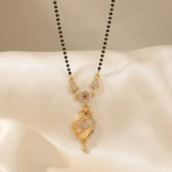 Gold_Toned_Crescent_Moon_Pendant_Necklace_With_Pink_Stones_And_Black_Enamel_Work