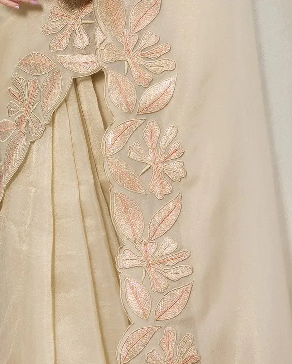 Elegant_Cream_Embroidered_Saree_with_Floral_Border_Work