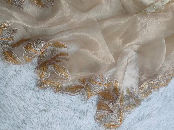 Elegant_Cream_Embroidered_Saree_with_Floral_Border_Work