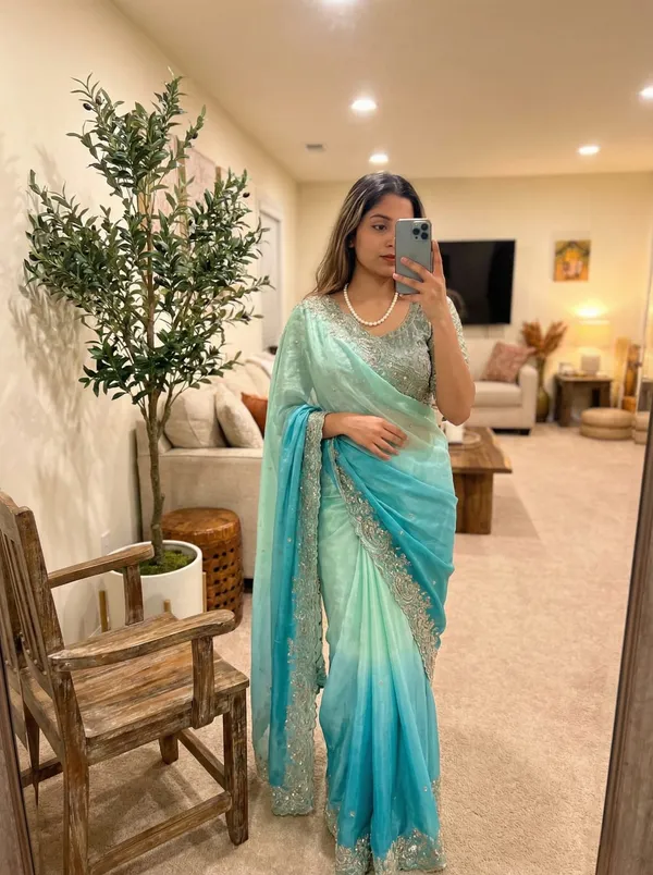 Elegant_Turquoise_Blue_Embellished_Saree_with_Silver_Border_and_Sequin_Blouse