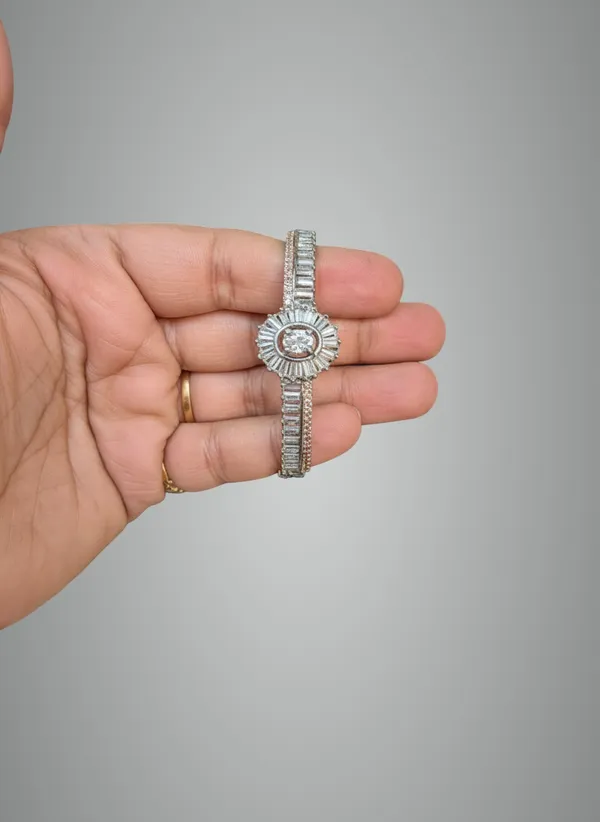 Elegant_Silver_Toned_Floral_Bangle_Bracelet_With_Baguette_Stone_Detailing