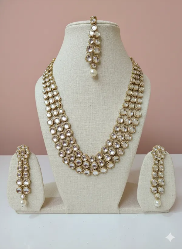 Gold_And_White_Elegant_Kundan_Pearl_Multi_Strand_Necklace_Set_With_Earrings_Maang_Tikka_For_Women