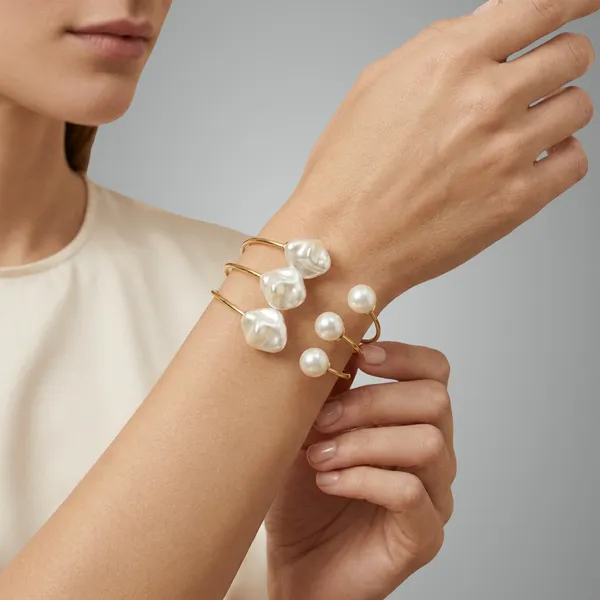 Gold_Toned_Pearl_Terminal_Adjustable_Bangles_With_Decorative_Pearl_Charms_Set_Of_2