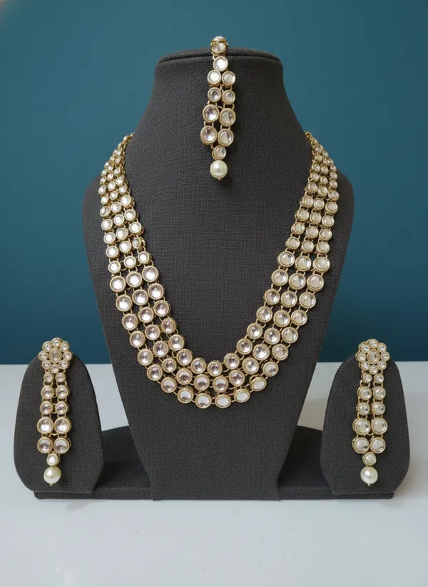 Gold_And_White_Elegant_Kundan_Pearl_Multi_Strand_Necklace_Set_With_Earrings_Maang_Tikka_For_Women