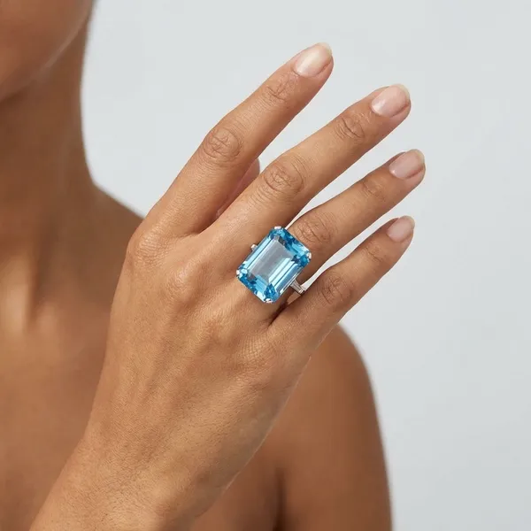 Blue_Topaz_Emerald_Cut_Statement_Ring_With_Diamond_Accents