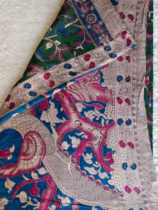 Elegant_Green_Kalamkari_Printed_Saree_With_Artistic_Border