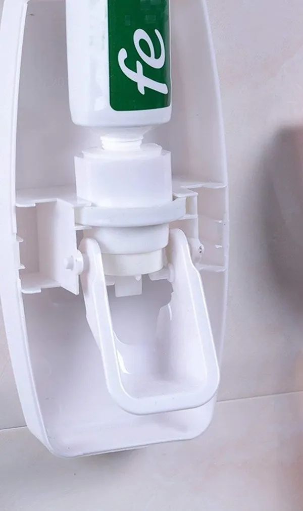 Pink_Wall_Mounted_Automatic_Toothpaste_Dispenser_With_Toothbrush_Holder_Set