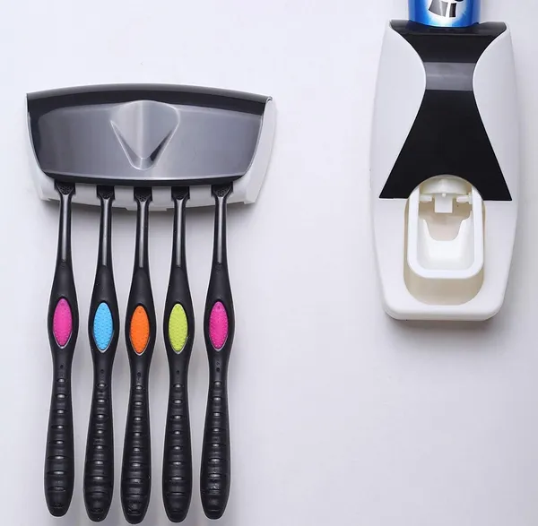 Pink_Wall_Mounted_Automatic_Toothpaste_Dispenser_With_Toothbrush_Holder_Set
