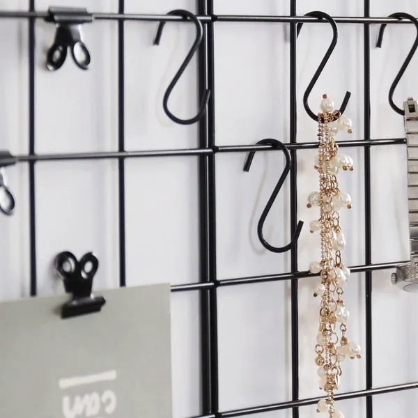 Black_Wall-Mounted_Metal_Grid_Panel_With_Shelves_And_Hooks