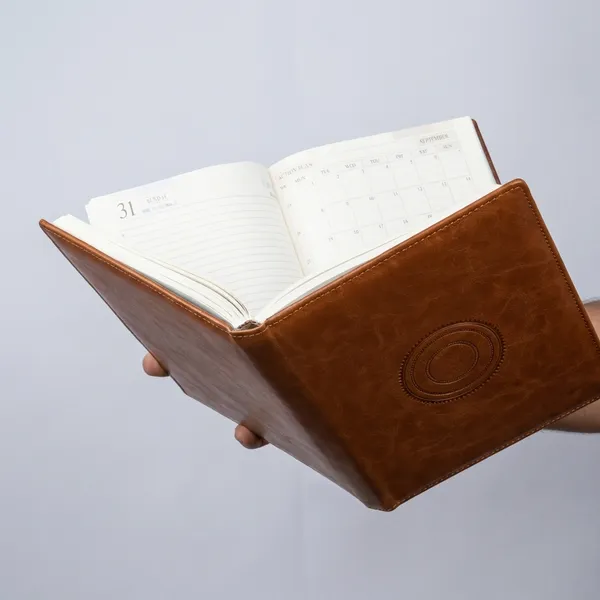 Premium_Tan_Leather_Diary_With_Embossed_Circle_Design_2024_Calendar_Planner