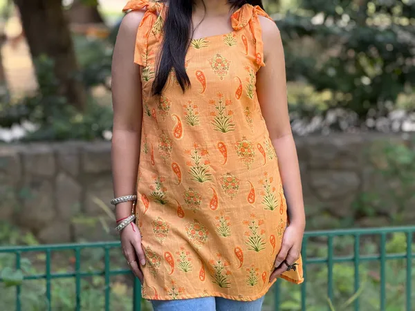 Orange_Floral_Printed_Cotton_Kurti_With_Tie_Up_Shoulder_To_Straps_With_Lace_Detailing_At_Back_For_Women