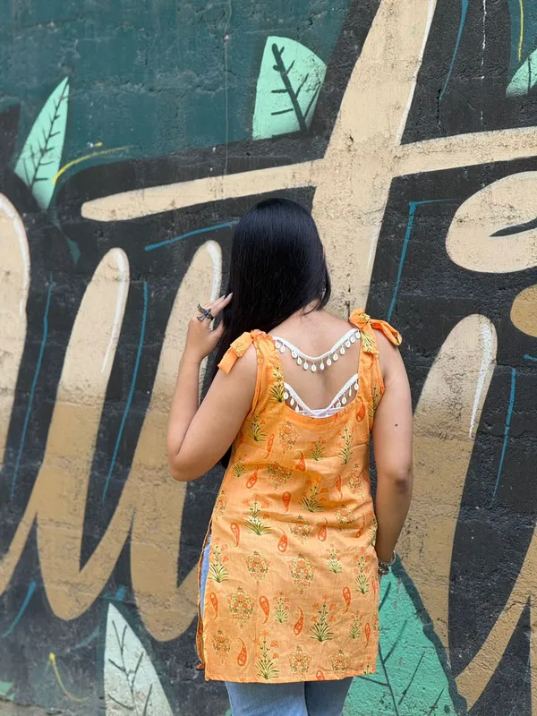 Orange_Floral_Printed_Cotton_Kurti_With_Tie_Up_Shoulder_To_Straps_With_Lace_Detailing_At_Back_For_Women