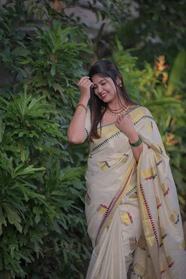 Off-White_Weave_Golden_Tissue_Saree_With_Temple_Borders_And_Yellow_Flower_Embroidery_Saree_For_Women_Pack_Of_2