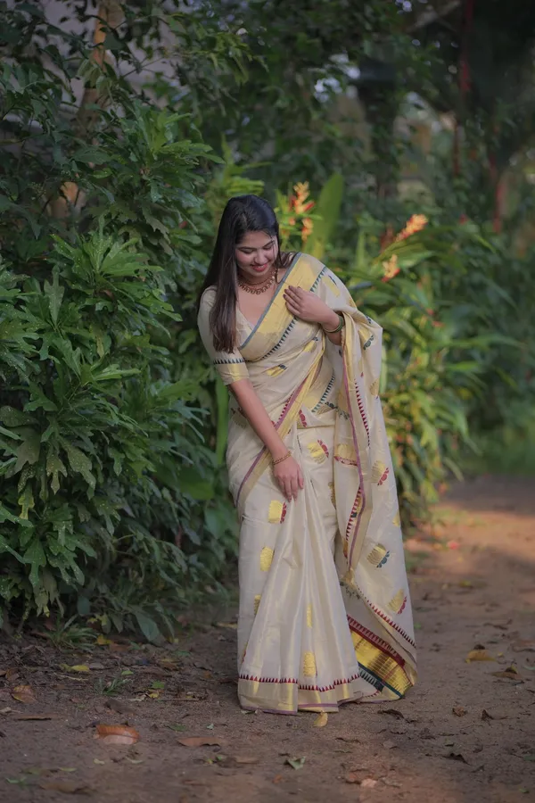 Off-White_Weave_Golden_Tissue_Saree_With_Temple_Borders_And_Yellow_Flower_Embroidery_Saree_For_Women_Pack_Of_2