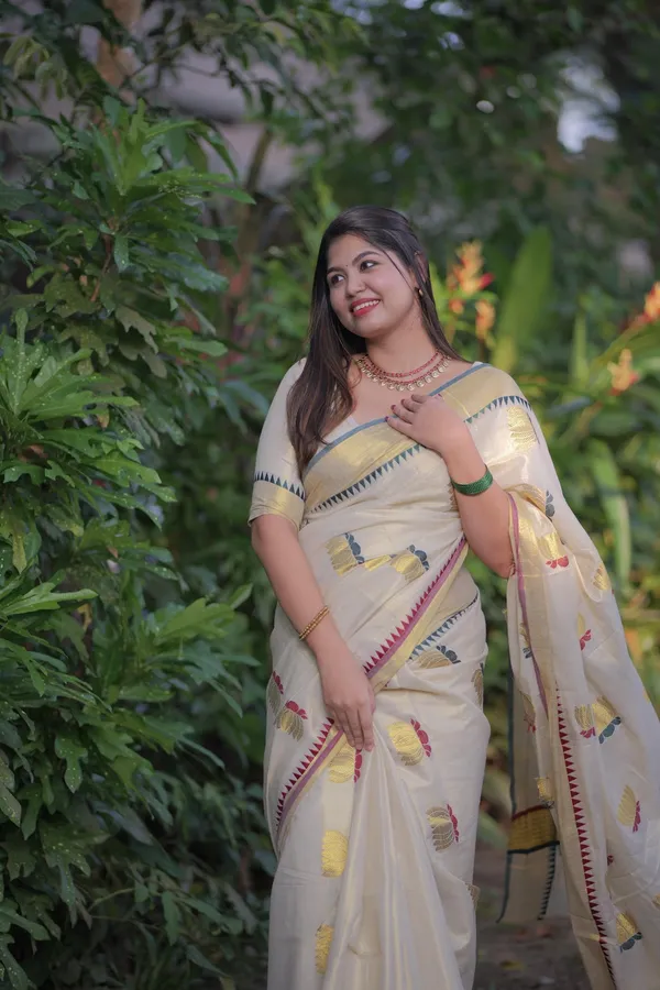 Off-White_Weave_Golden_Tissue_Saree_With_Temple_Borders_And_Yellow_Flower_Embroidery_Saree_For_Women_Pack_Of_2