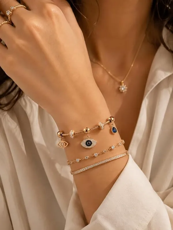 Evil_Eye_Charm_Bracelet_for_Women_with_Blue_Danglers_|_Twisted_Cable_Bangle,_Crystal_Pave_Evil_Eye_Charms,_Magnetic_Clasp