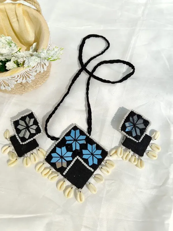 Handcrafted_Black_Fabric_Necklace_With_Blue_Floral_Embroidery_And_Shell_Accents
