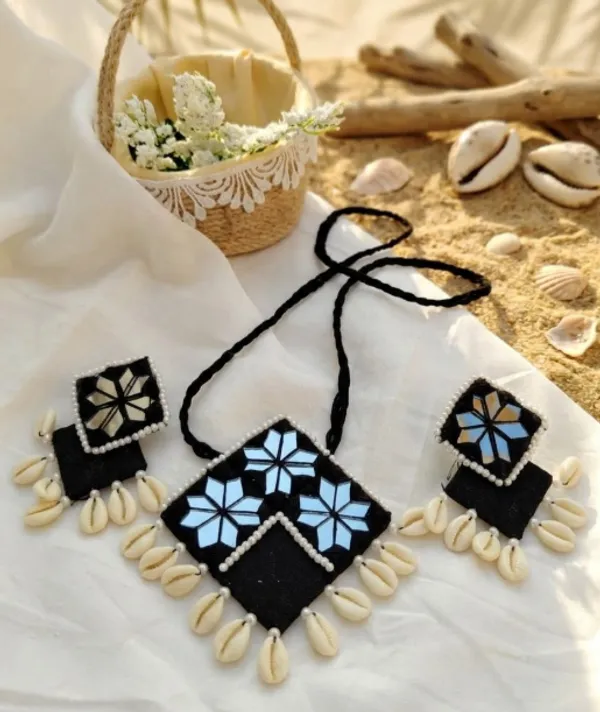 Handcrafted_Black_Fabric_Necklace_With_Blue_Floral_Embroidery_And_Shell_Accents