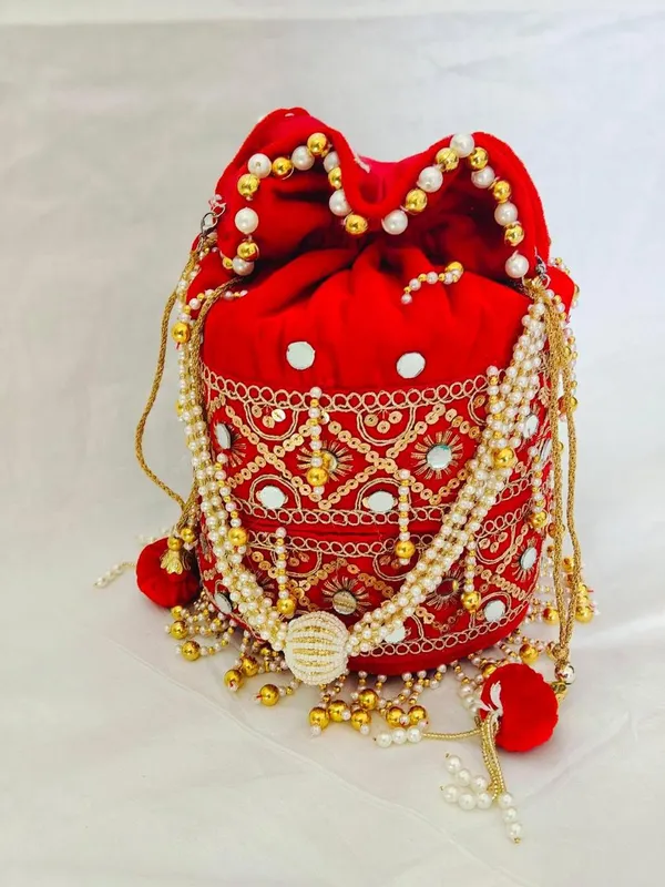 Red_Embellished_Potli_Bag_With_Pearl_And_Gold_Detailing